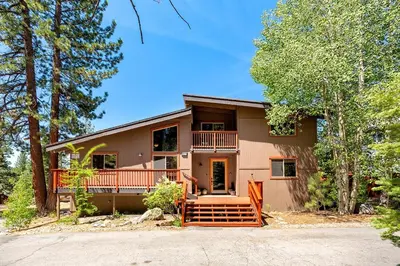 a large house with a porch and a driveway at Cold Creek Lodge home in South Lake Tahoe