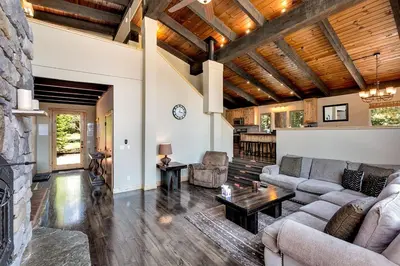 a living room with a couch and a table at Cold Creek Lodge home in South Lake Tahoe