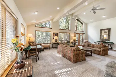 a living room with a couch and a table at Silver Rock Lodge home in Zephyr Cove