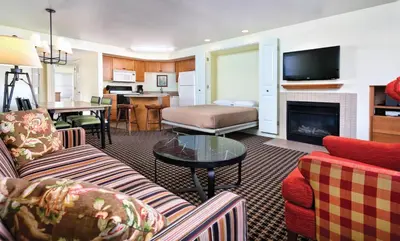a living room with a couch and a fireplace at Wyndham Angels Camp 1BR Apartment with Resort Access in Angels Camp