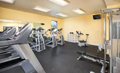 a gym with treadmills and elliptical machines at Wyndham Angels Camp 2BR Apartment with Resort Access in Angels Camp