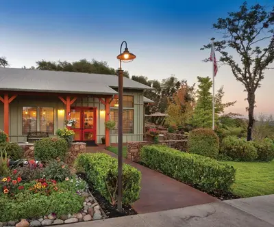 a house with a street light in a garden at Wyndham Angels Camp 2BR Apartment with Resort Access in Angels Camp