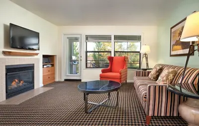 a living room with a couch and a fireplace at Wyndham Angels Camp 3BR Apartment with Resort Access in Angels Camp