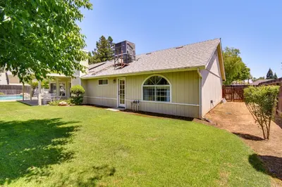 a house with a yard with a fence at Clovis Family Home Private Pool, Near Old Town! in Clovis