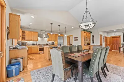 a kitchen and dining room with a table and chairs at Wooded Escape in Tahoe Vista Private Hot Tub in Tahoe Vista