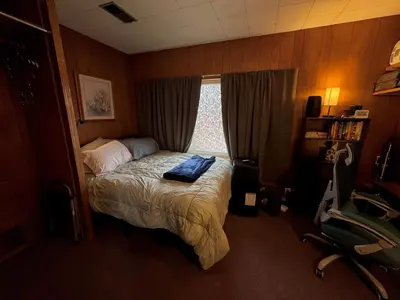 a small bedroom with a bed with a window at 1br 1ba private ADU in Sacramento