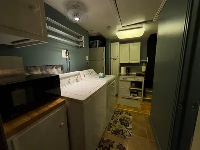 a kitchen with a stove and a white counter top at 1br 1ba private ADU in Sacramento