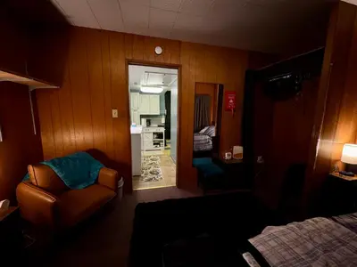 a hotel room with a couch and a bedroom at 1br 1ba private ADU in Sacramento