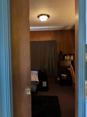 a room with a room with a bed and a light at 1br 1ba private ADU in Sacramento