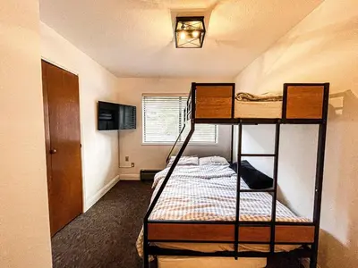 a bedroom with two bunk beds in a room at Tahoe Peaks & Shores Getaway in Kings Beach