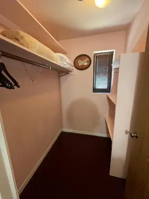 a room with a closet with a clock on the wall at Boutique Retreat in Wine & Gold Country in Placerville