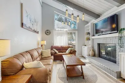 a living room with a couch and a fireplace at Mountain Serenity in Incline Village