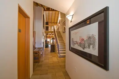 a hallway with a large picture on the wall at Downtown Penthouse condo in South Lake Tahoe