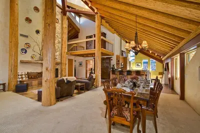 a dining room with a table and chairs in a house at Downtown Penthouse condo in South Lake Tahoe