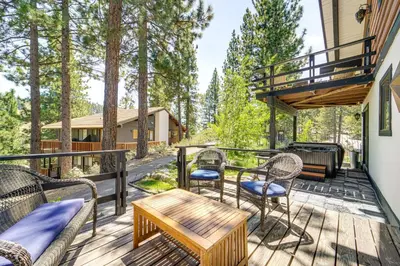 a deck with chairs and a table and a grill at Walk to Diamond Peak Luxe Chalet with Mtn-View Deck in Incline Village