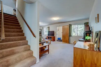 a living room with a staircase and a living room at Peak Summer - Relax & Refresh - Charming Kings Beach in Tahoe Vista