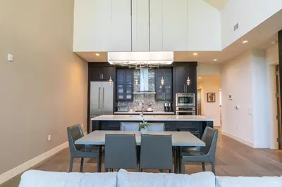 a dining room with a table and chairs and a kitchen at Crystal Bay Penthouse 301 condo in Crystal Bay