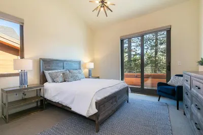 a bedroom with a bed and a dresser and a window at Crystal Bay Penthouse 301 condo in Crystal Bay