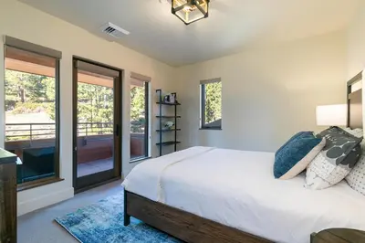 a bedroom with a bed and a balcony at Crystal Bay Penthouse 301 condo in Crystal Bay