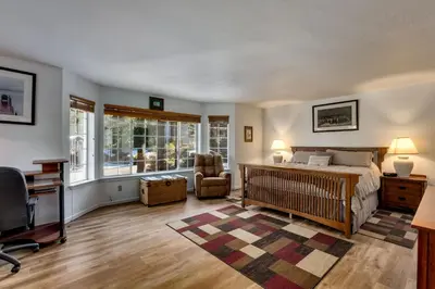 a bedroom with a bed and a desk and a chair at Panhandle House home in South Lake Tahoe