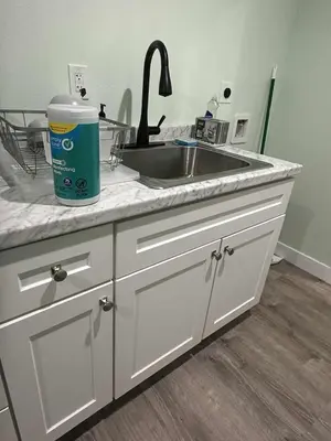 a kitchen counter top with a sink and a sink at Macau Studio-Guesthouse by Sac State and UCDMC in Sacramento