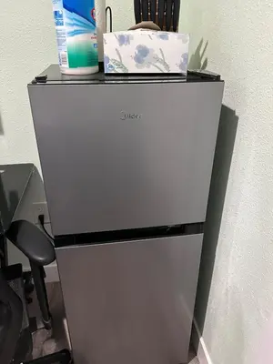 a white cabinet with a laptop on top of it at Macau Studio-Guesthouse by Sac State and UCDMC in Sacramento