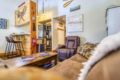 a living room with a couch and a table at TahoeCozy with Pool Hot Tub and Near Northstar in Tahoe Vista