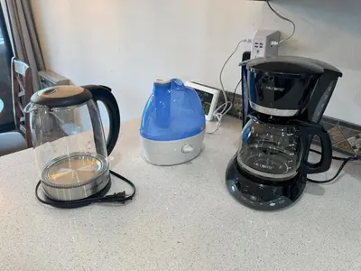 two coffee makers and a blender on a counter at Fireside Condo at the Village - Remodeled in Mammoth Lakes