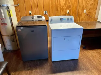 a stove and a washing machine in a kitchen at Fireside Condo at the Village - Remodeled in Mammoth Lakes