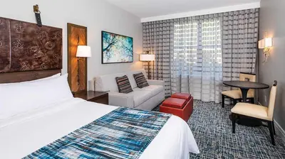 a hotel room with a bed and a living room at Marriott Timber Lodge 2BR Apartment with Resort Access in South Lake Tahoe
