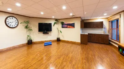 an office with a clock on the wall and plants at Marriott Timber Lodge 3BR Apartment with Resort Access in South Lake Tahoe