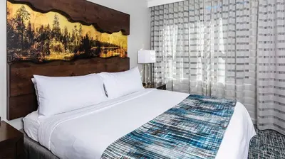 a bedroom with a large white bed and a window at Marriott Timber Lodge 3BR Apartment with Resort Access in South Lake Tahoe