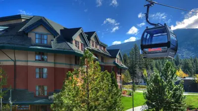 a gondola lift in front of a house at Marriott Timber Lodge 3BR Apartment with Resort Access in South Lake Tahoe