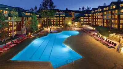 a large swimming pool in front of a building at Marriott Timber Lodge Studio Apartment with Resort Access in South Lake Tahoe