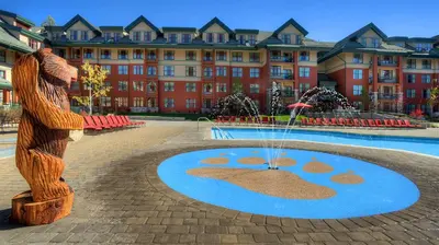 a statue in front of a building with a fountain at Marriott Timber Lodge Studio Apartment with Resort Access in South Lake Tahoe