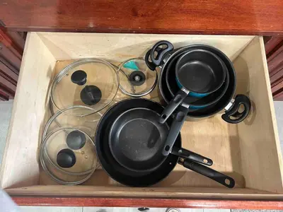 a wooden box filled with pots and pans at Rustic Retreat 3 bd/2 bth - Large Family Game Area in Fresno