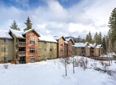 a group of apartment buildings in the snow at Wyndham South Shore 1BR Apartment with Resort Access in Zephyr Cove