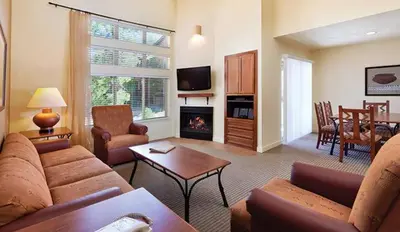 a living room with a couch and a fireplace at Wyndham South Shore 1BR Apartment with Resort Access in Zephyr Cove