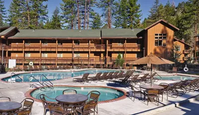 a resort with a swimming pool with tables and chairs at Wyndham South Shore 3BR Apartment with Resort Access in Zephyr Cove