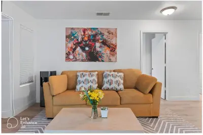 a living room with a couch and a table at Elegant Retreat- Sleep 10-Boho Dome Lounge-Hot Tub-Games-Golf-Serene Getaway in Sacramento