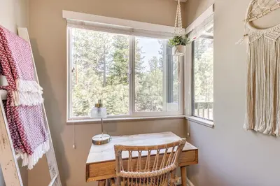a room with a wooden table and a window at Stroll to The Village Year-Round Family Getaway in Mammoth Lakes