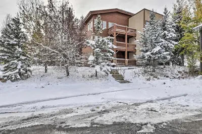 a house in the snow with a driveway at Stroll to The Village Year-Round Family Getaway in Mammoth Lakes