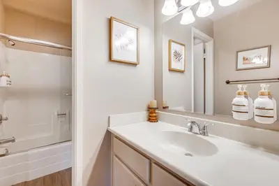 a bathroom with a sink and a mirror at Stroll to The Village Year-Round Family Getaway in Mammoth Lakes