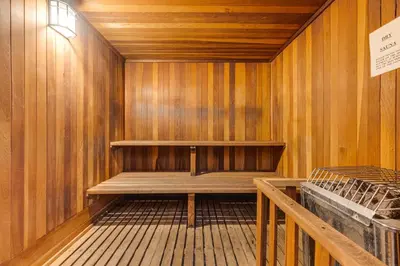 a sauna with a bench in a wooden wall at Stroll to The Village Year-Round Family Getaway in Mammoth Lakes