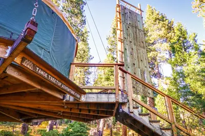 a deck of a tree house in the woods at Unit 18B at Granlibakken in Tahoe City