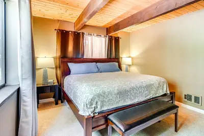 a small bedroom with a bed and a window at Cabin Getaway Near Big Trees Park Game Room, Deck in Camp Connell