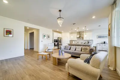 a living room with a couch and a table at 4 Mi to San Joaquin River Manteca Home with Patio! in Manteca