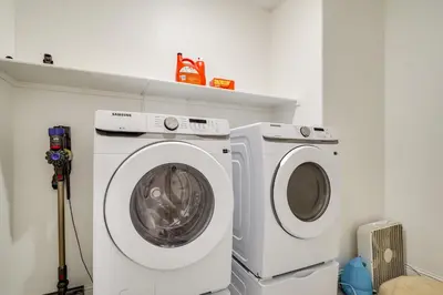 a washing machine and a washer in a room at 4 Mi to San Joaquin River Manteca Home with Patio! in Manteca