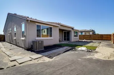 a house is being remodeled with a yard at 4 Mi to San Joaquin River Manteca Home with Patio! in Manteca