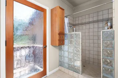 a bathroom with a shower and a glass door at Yosemite+5BR+Views+Hot Tub+Pets in Coarsegold